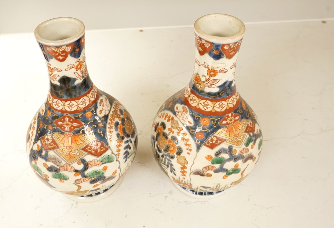 A pair of 19th century Japanese Imari bottle vases, 22cm high